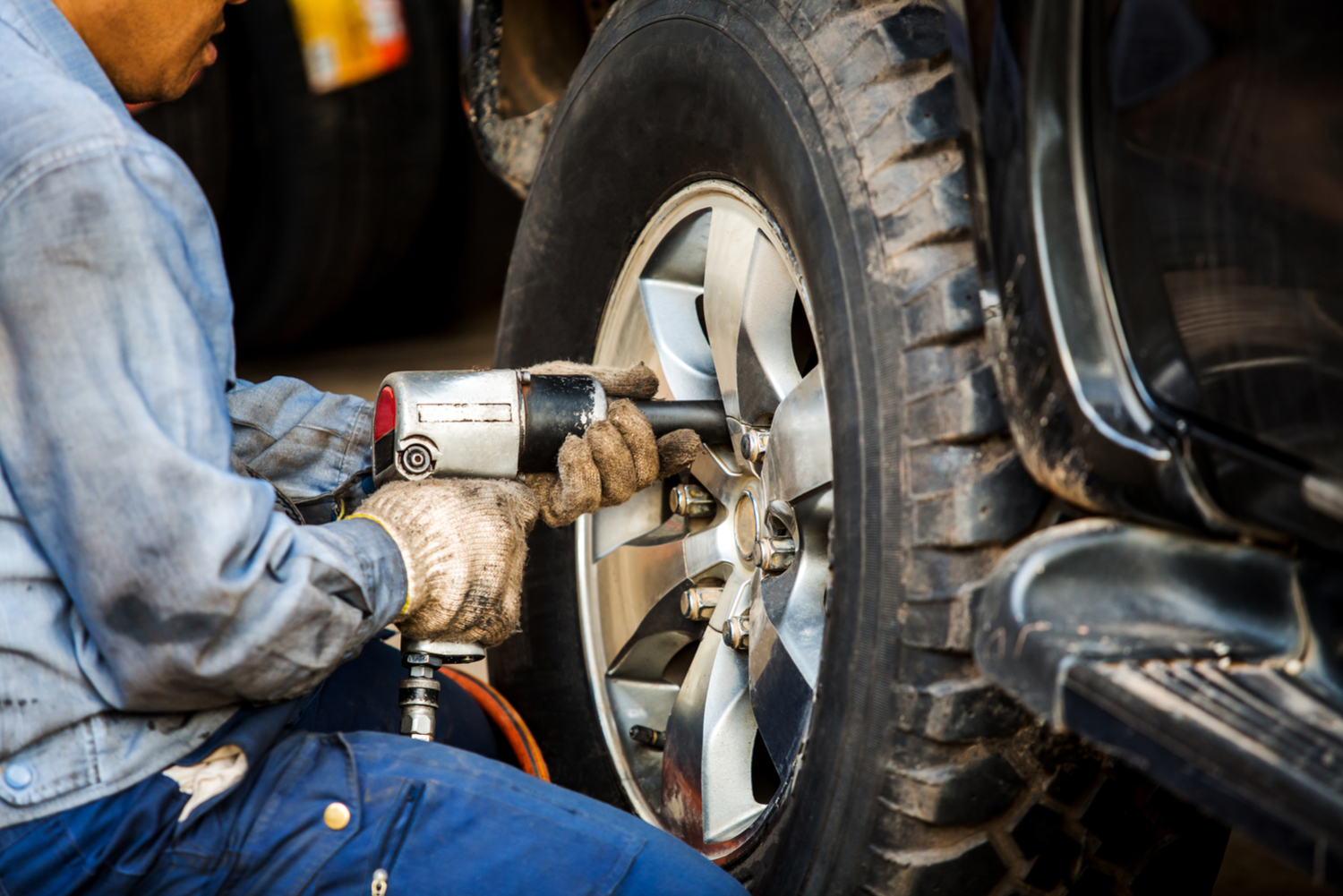 Mechanic changes a tire