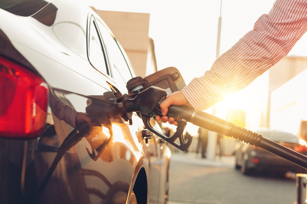 Man fueling up a car