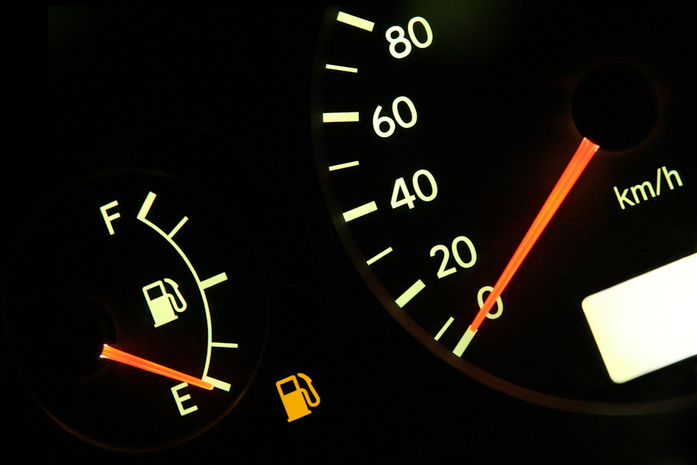 car dashboard gauge indicating no fuel