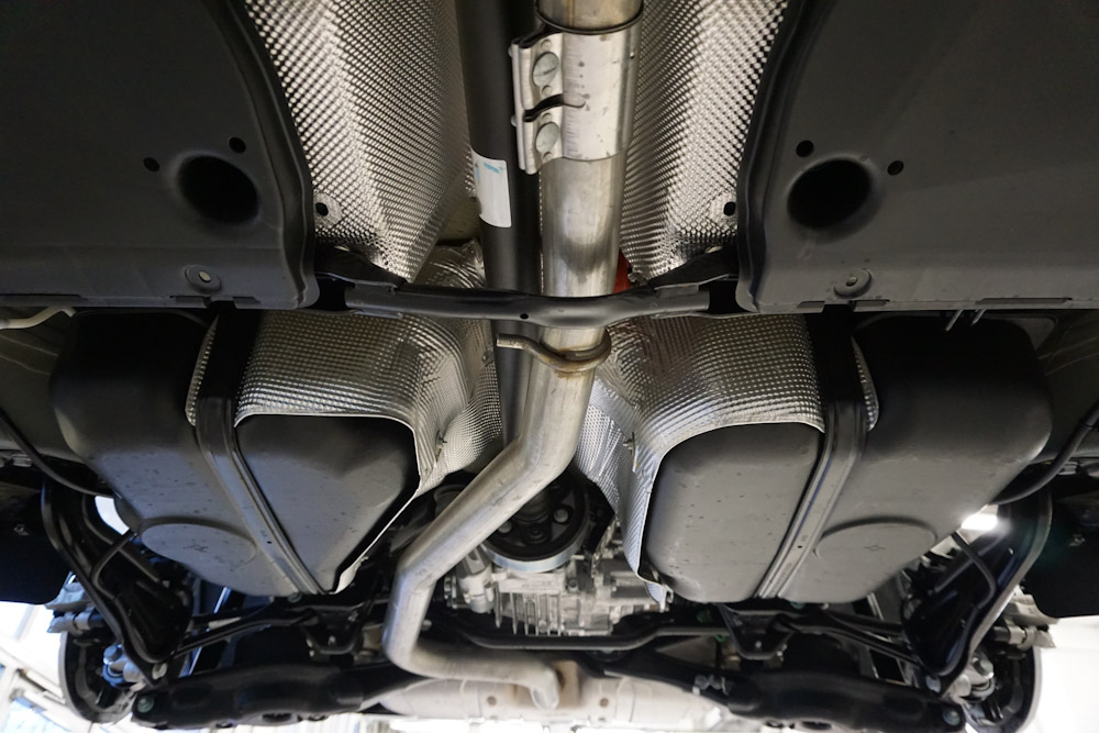 Image of vehicle exhaust system undergoing auto repair