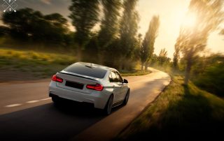 Car driving down mountain roadway