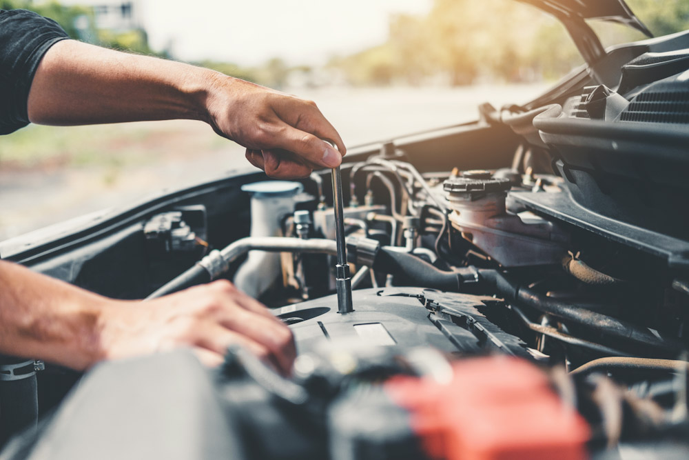 Auto mechanic working in garage Technician Hands of car mechanic