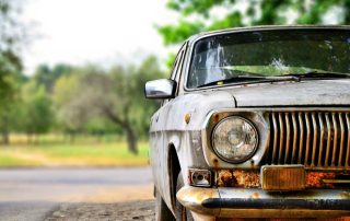 Old car in parking lot