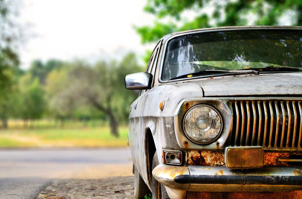 Old car in parking lot