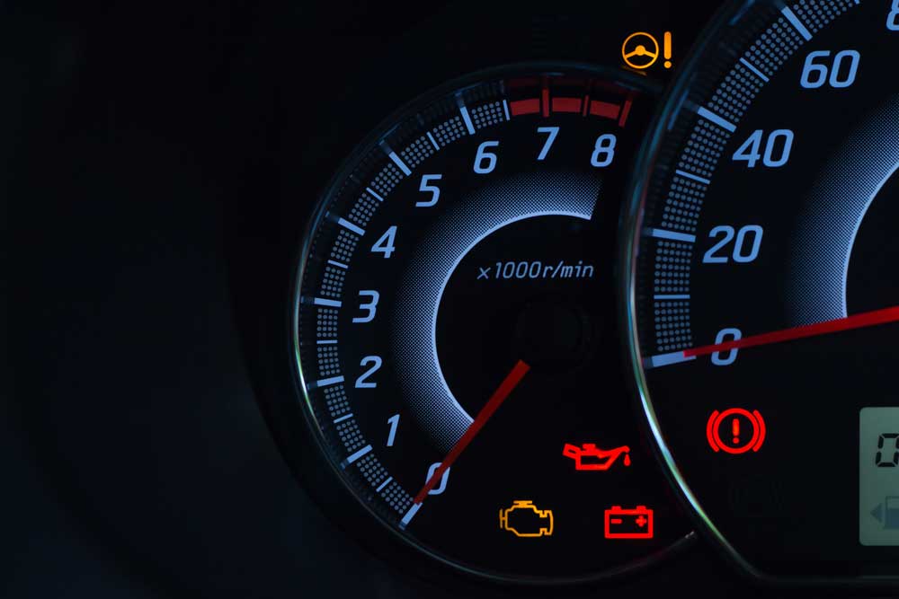 Image of illuminated dashboard warning lights