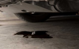 Oil puddle on garage floor. Auto repair concept