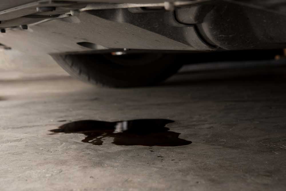 Oil puddle on garage floor. Auto repair concept