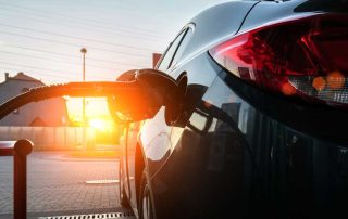 Car at pump filling up on gas