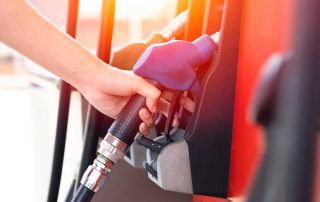 Refueling car. Pump gas at petrol fuel station. Gasoline oil nozzle tank from hand person. Automotive industry or transportation concept.