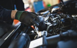 mechanic changing oil filter