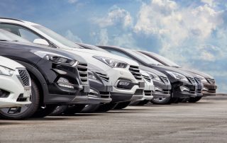 cars lined up on lot for purchase