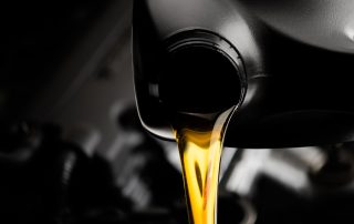 motor oil being poured into engine. oil change concept