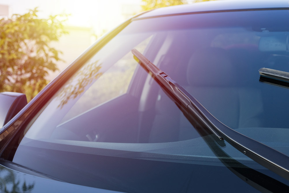 Car windshield with new wipers.