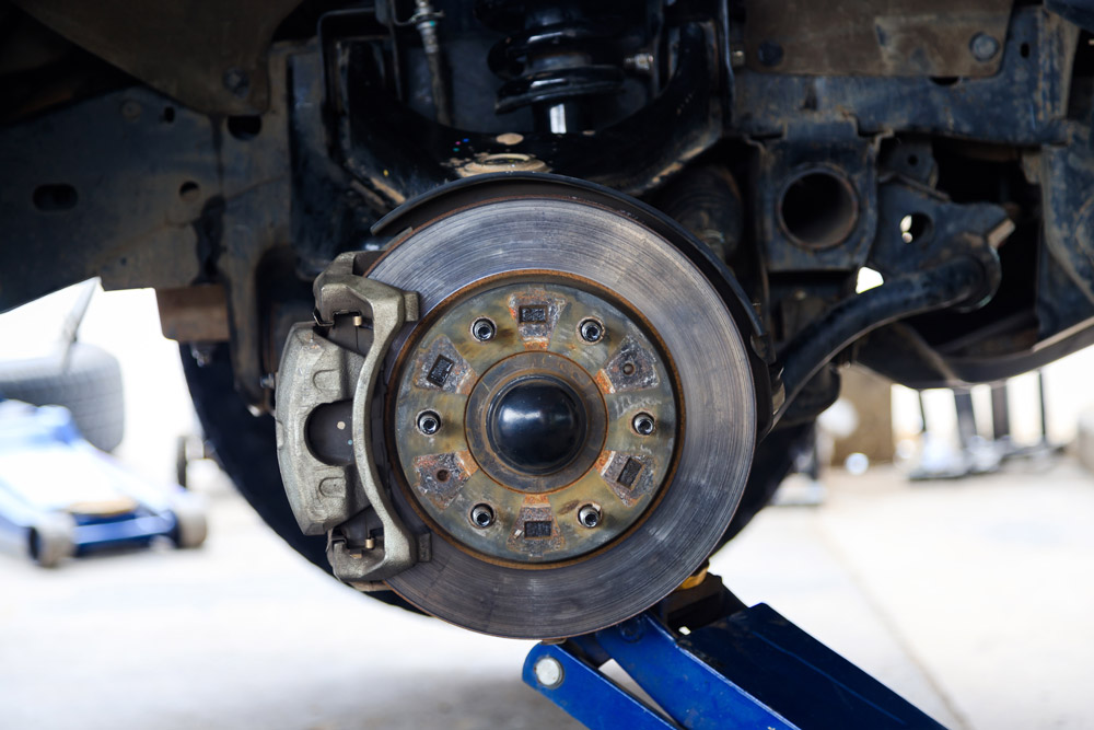 Close-up of exposed car brake system.