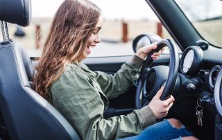 teenager driving her first car