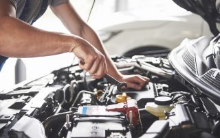 mechanic maintaining car