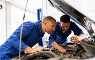 mechanics checking car for problems