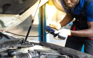 mechanic doing engine diagnostics test