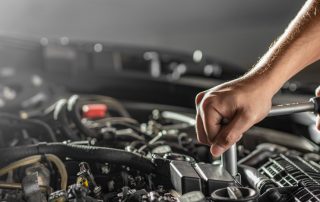 mechanic working on engine repair