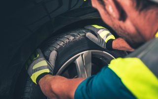 mechanic replaces tire