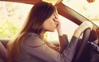 woman stressed driving car