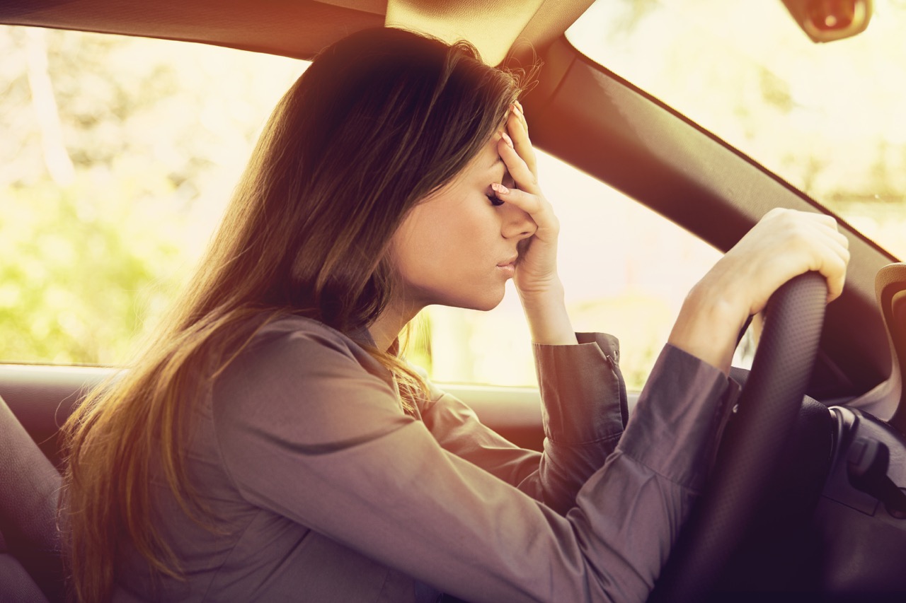 woman stressed driving car