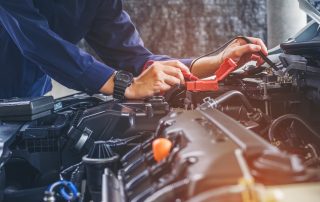 mechanic looking at engine