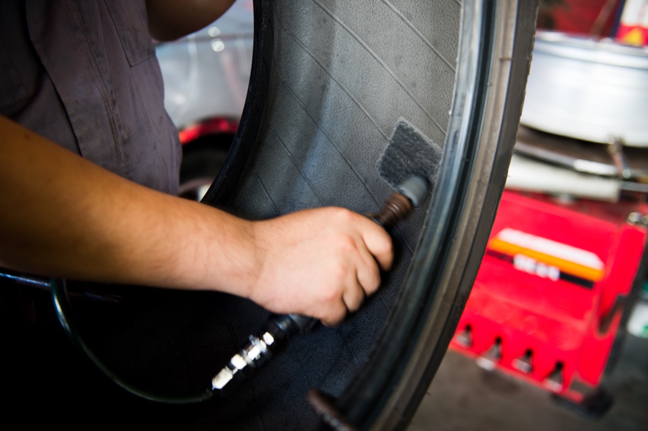 Mechanic patching a tire