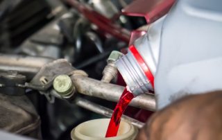 transmission fluid pouring into engine