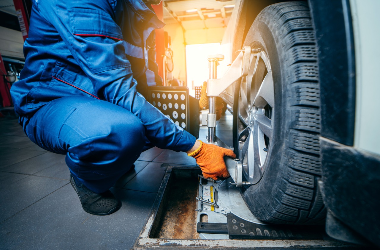 mechanic conducting a tire alignment