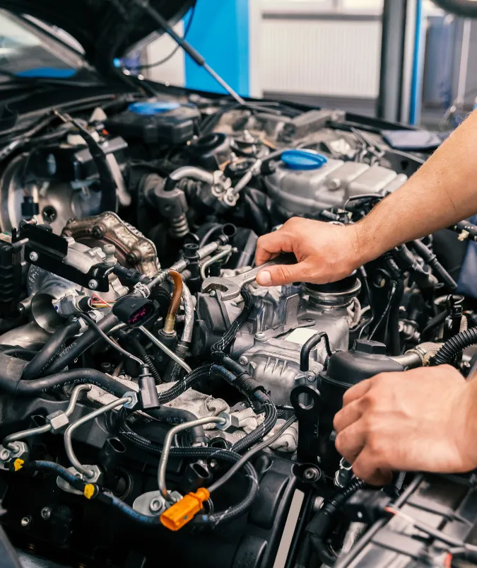 Technician working on a diesel engine