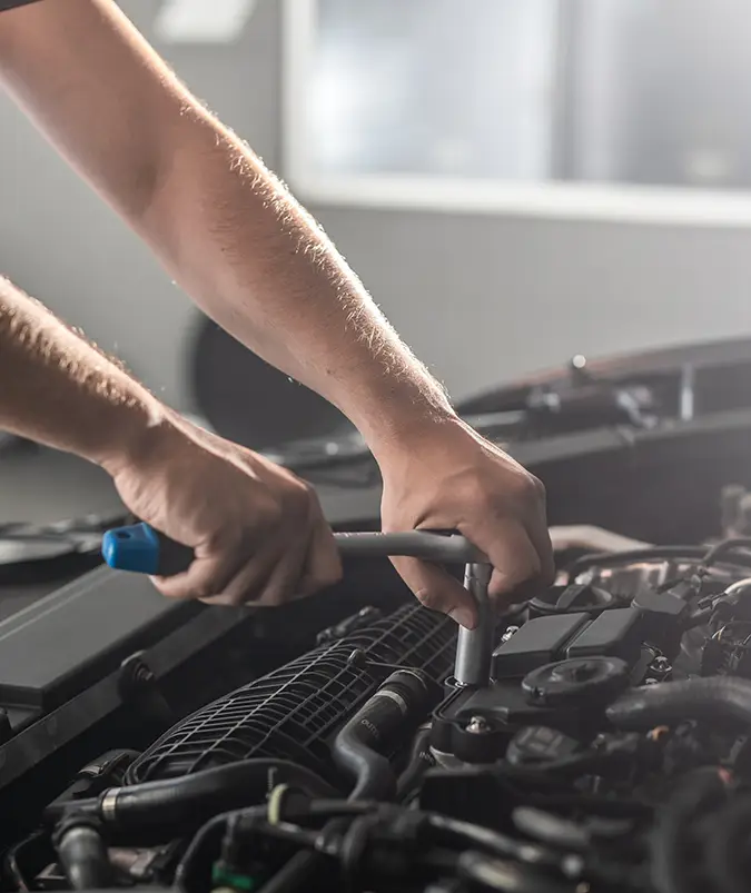 Technician working on engine